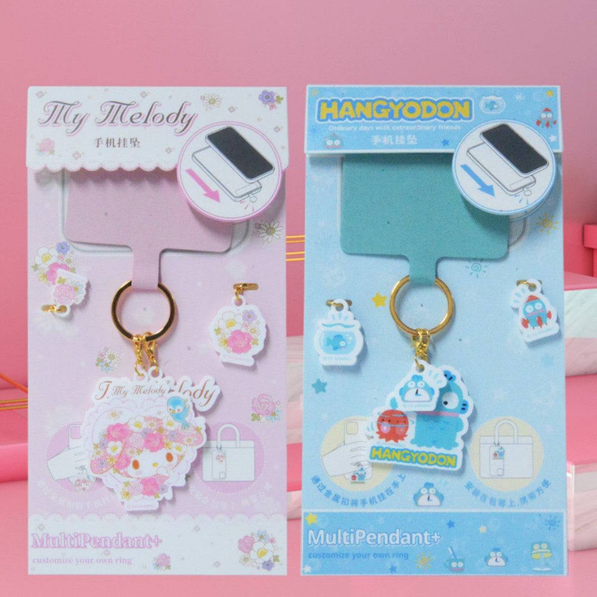 My Melody and Hangyodon Sanrio Characters Phone Strap Keychains displayed together. Adorable and practical phone charms for secure attachment.