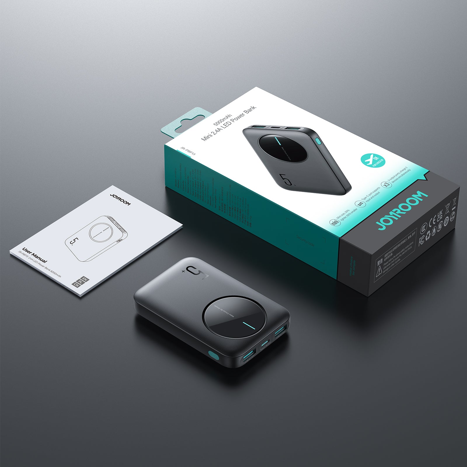 Unboxed JOYROOM JR-PBF13 Mini 2.4A LED Power Bank 5000mAh with user manual and retail packaging, showcasing product presentation.