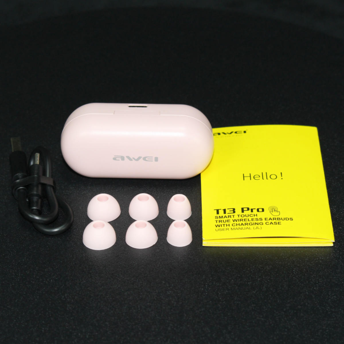 AWEI T13 Pro Earbuds unboxing. Includes charging case, USB cable, extra ear tips, and user manual for a complete audio experience.