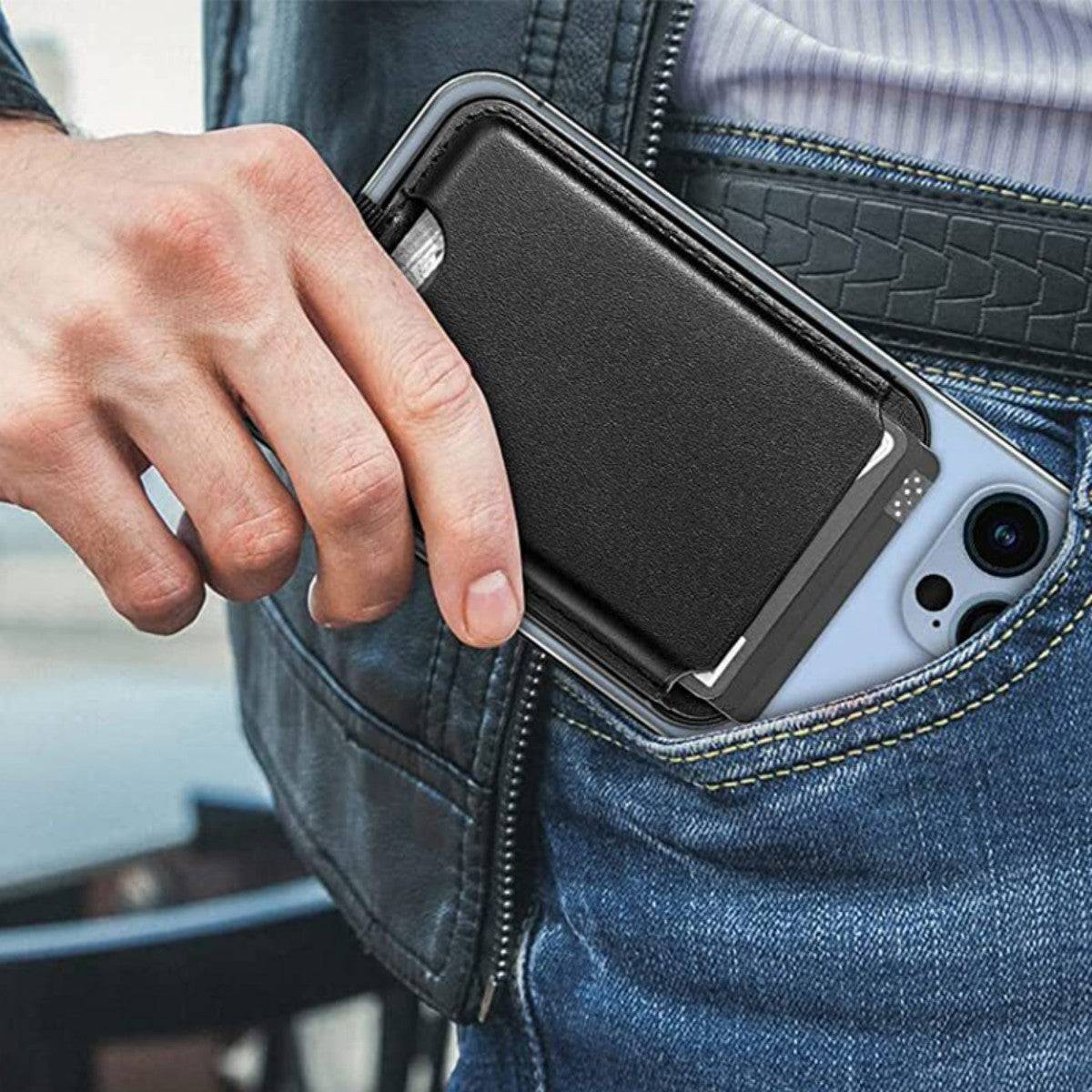 Man placing a black leather magnetic wallet stand attached to his smartphone into his pocket. A stylish and practical phone accessory.