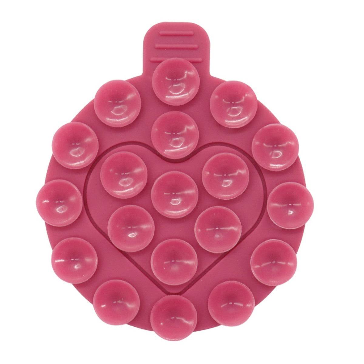 Pink heart-shaped silicone suction cup phone holder with strong adhesion, ideal for hands-free phone mounting.
