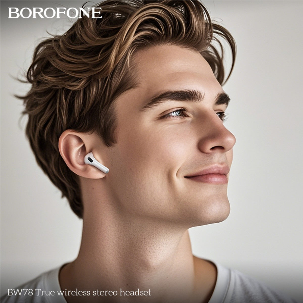 Man wearing BOROFONE BW78 True Wireless Stereo Headset White, showcasing comfortable fit and stylish design for everyday use.