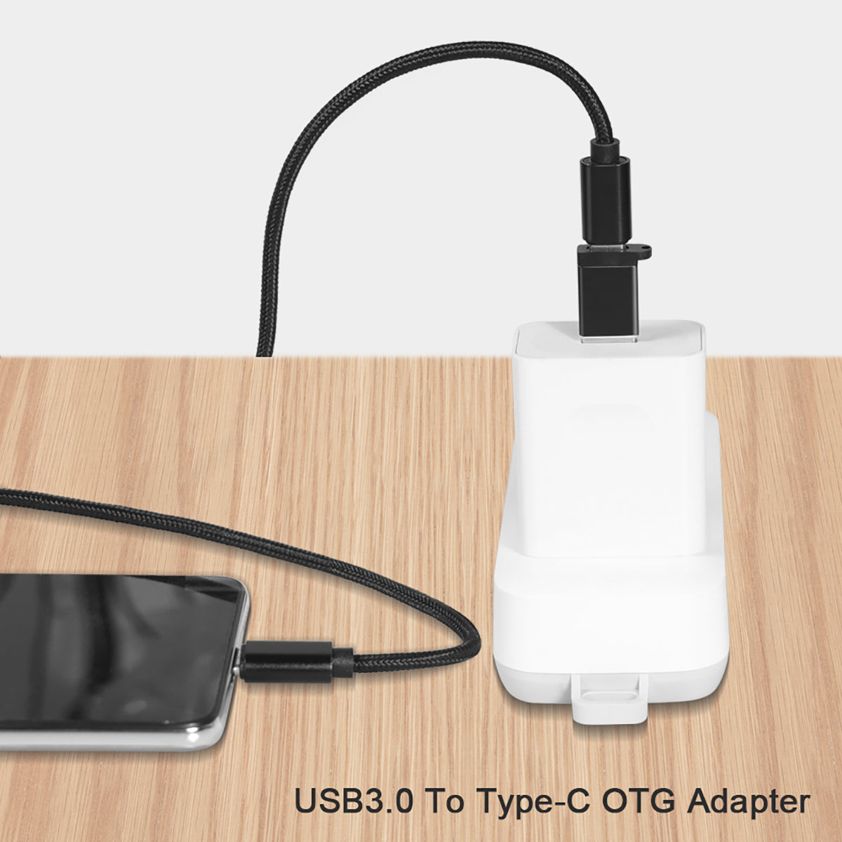FT-ADA18 USB to Type-C Adapter connected to a charger and smartphone, demonstrating OTG functionality and efficient charging.
