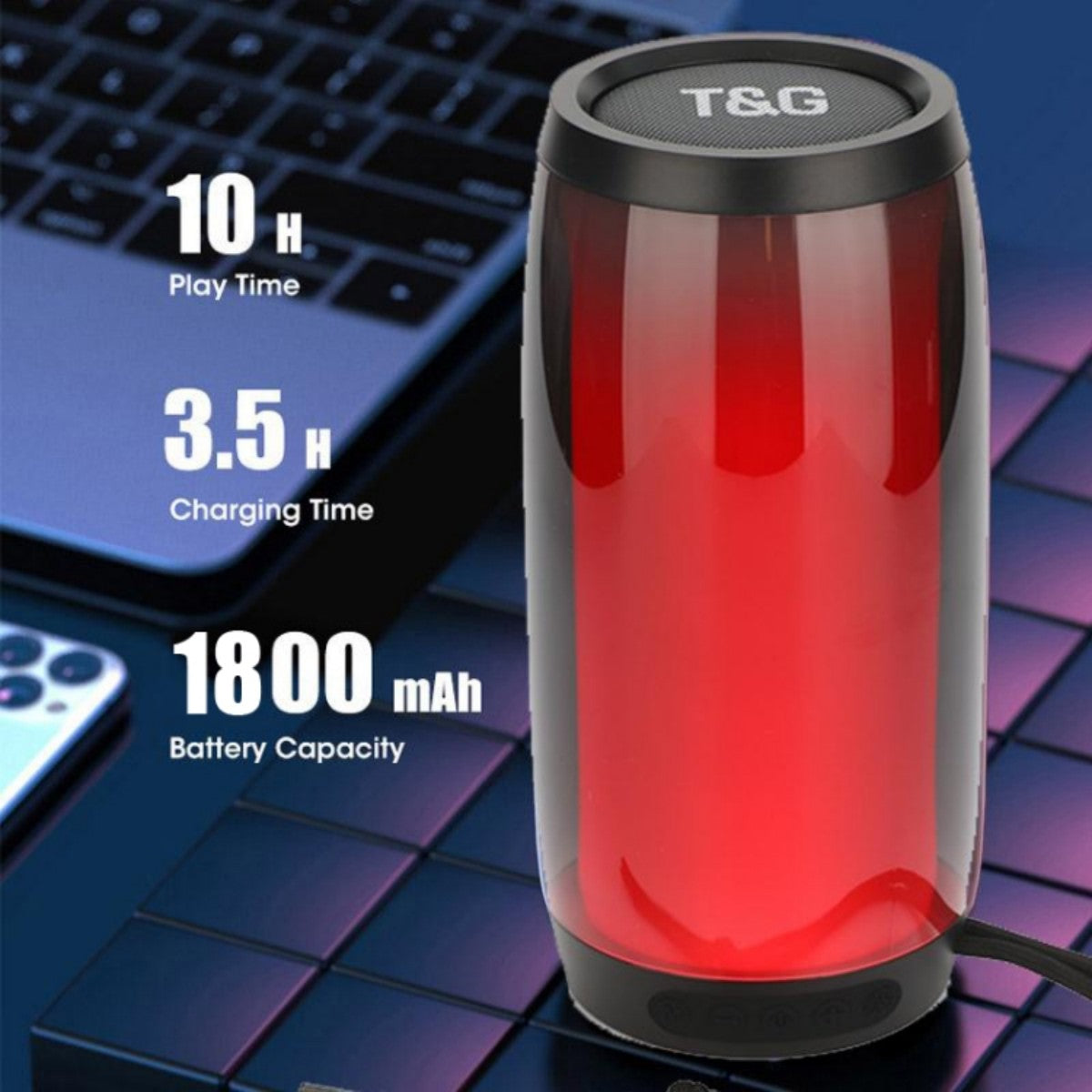 Red T&G TG335 Bluetooth Speaker with 1800mAh battery, 10-hour playtime, and 3.5-hour charging, shown on a tech setup background.