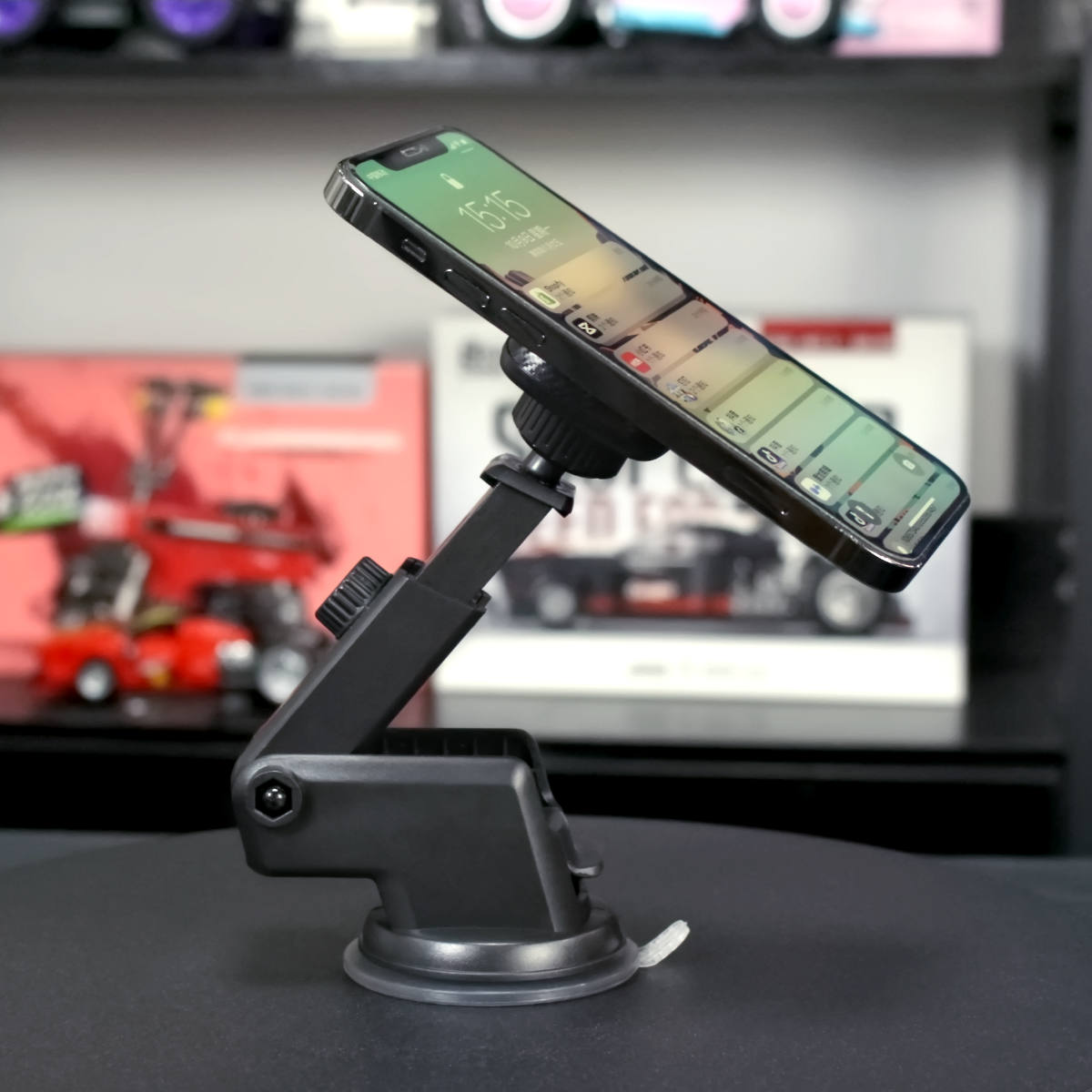 UN-22 Magnetic Car Phone Holder in use, securely holding a smartphone on a desk setup.