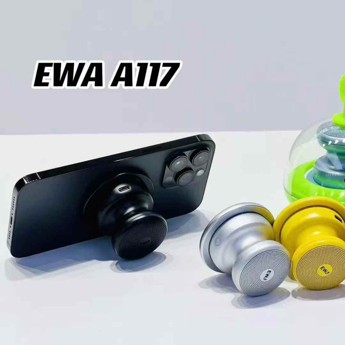 EWA A117 Portable Mini Bluetooth Speaker attached to a smartphone, showcasing its compact design and phone stand functionality.