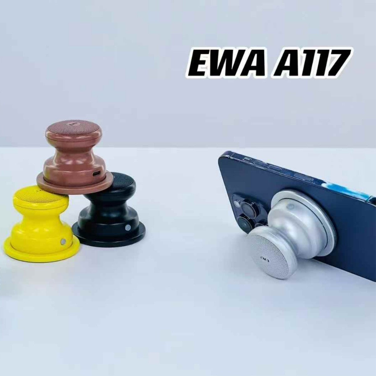 EWA A117 Portable Mini Bluetooth Speaker used as a phone stand, with other units stacked beside it for display.