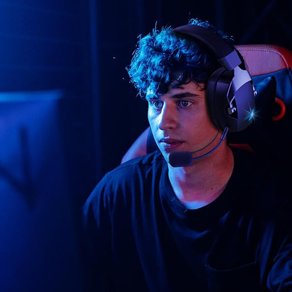 Gamer intensely focused while wearing Acinaci Wireless Gaming Headset with noise-canceling microphone and immersive sound.