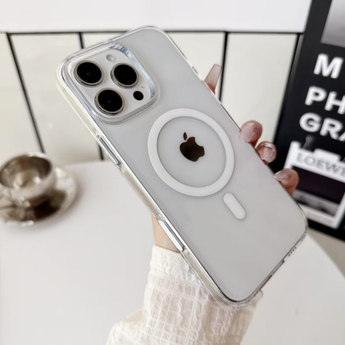 AuraGuard Series iPhone Clear Case with MagSafe ring, shown on iPhone with triple camera, offering sleek transparent protection.