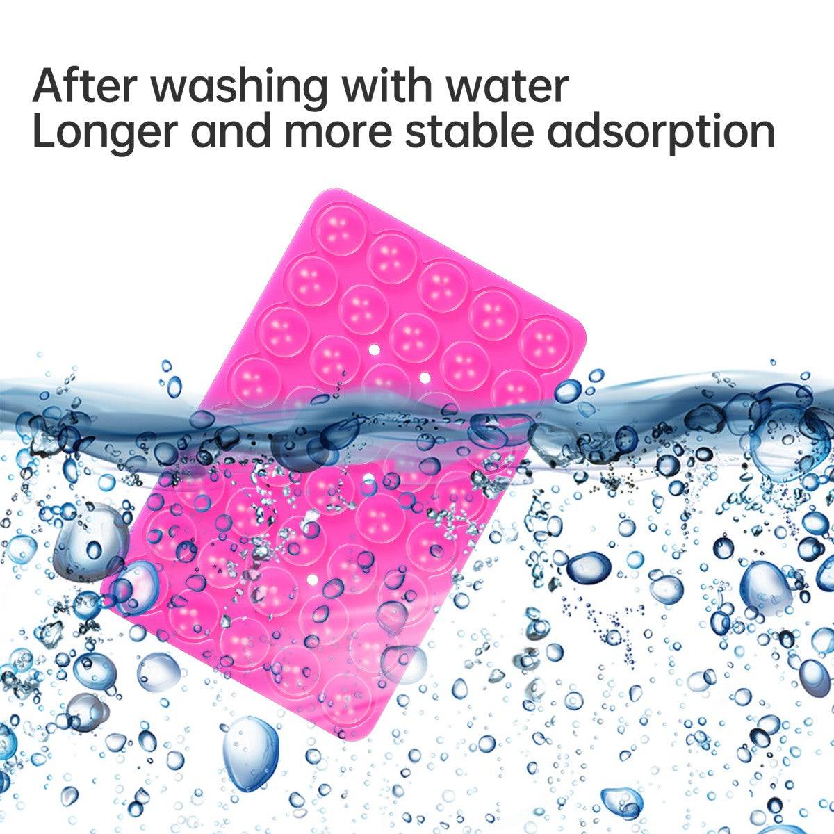 Pink silicone suction cup phone holder submerged in water, showcasing its washable and reusable adhesive properties.