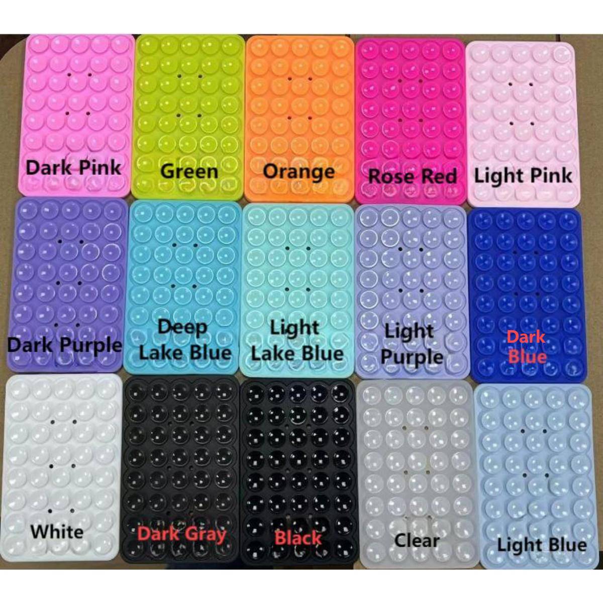 Multiple color options of double-sided silicone suction cup phone holders, including pink, blue, black, and green.