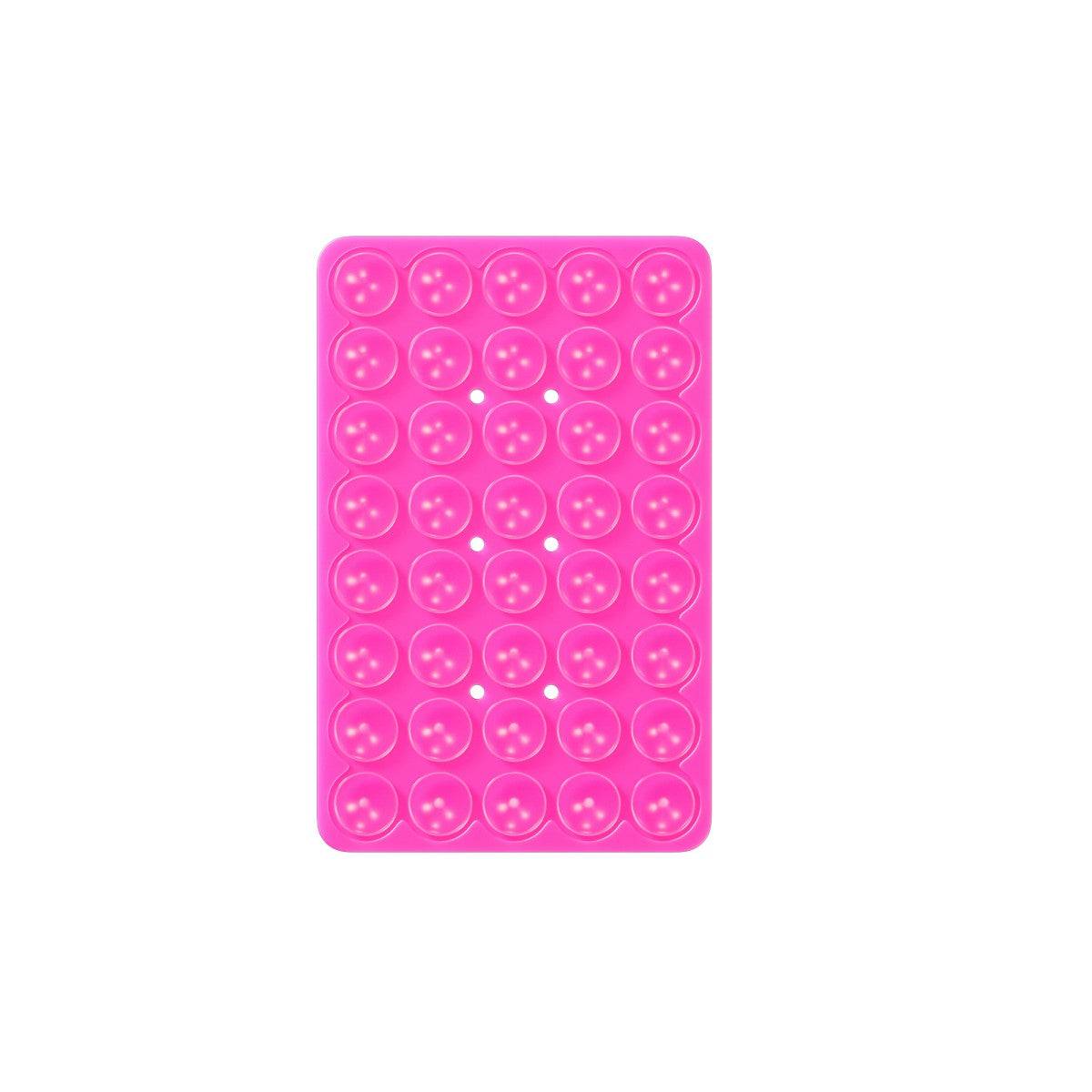 Pink rectangular silicone suction cup phone holder with 40 suction cups for strong adhesion on smooth surfaces.