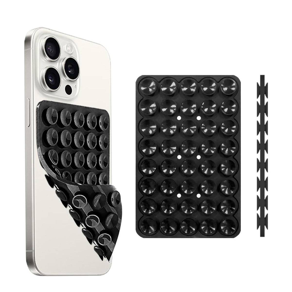 Black double-sided silicone suction cup phone holder attached to a smartphone, offering strong and reusable adhesion.