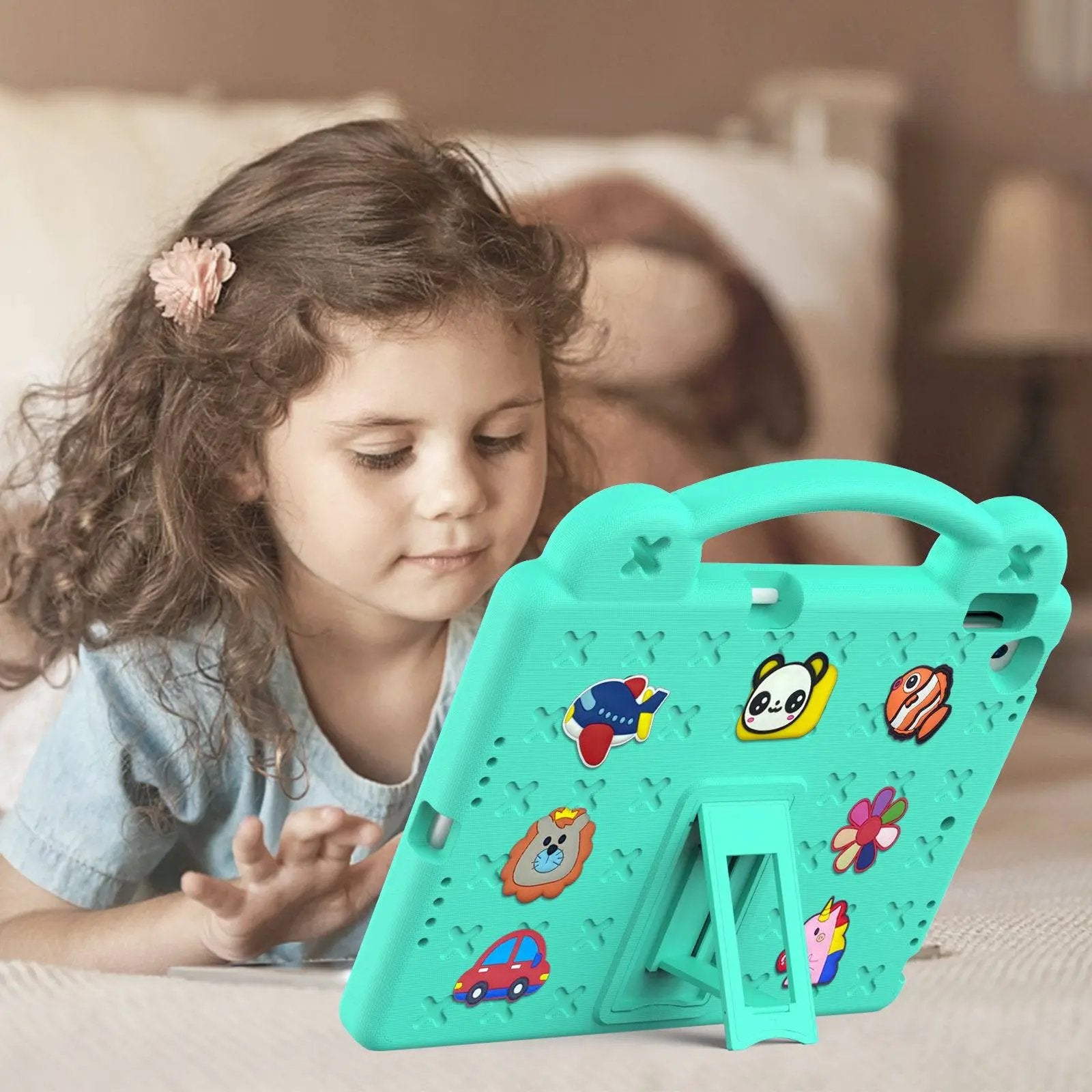 Young girl using a green Handle Kids iPad Protective Case 10.2/10.5 inch with a built-in stand, designed for durability and child-friendly use.
