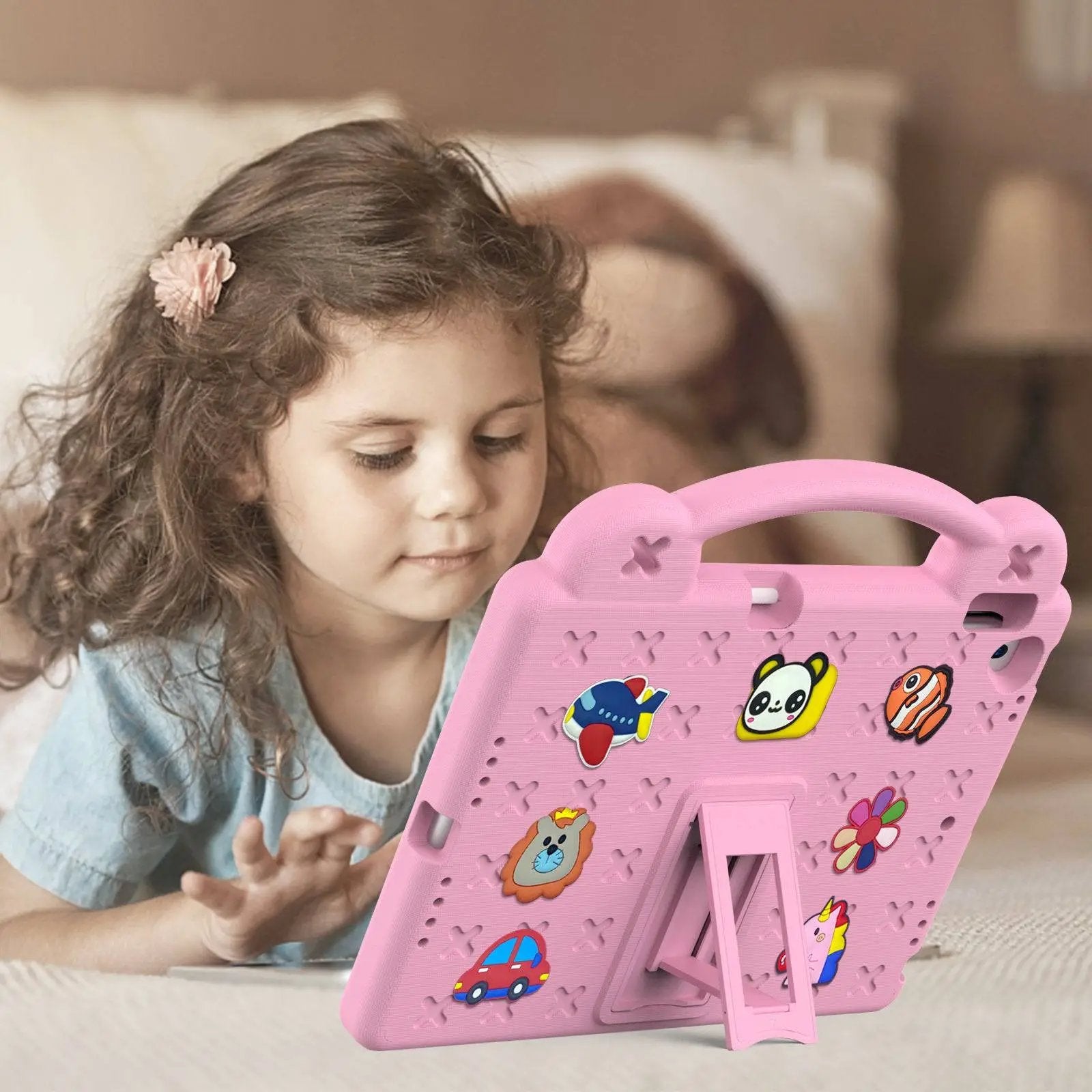 A young girl using the pink Handle Kids iPad Mini 6 Protective Case with a built-in stand, ensuring a comfortable and secure tablet experience for kids.