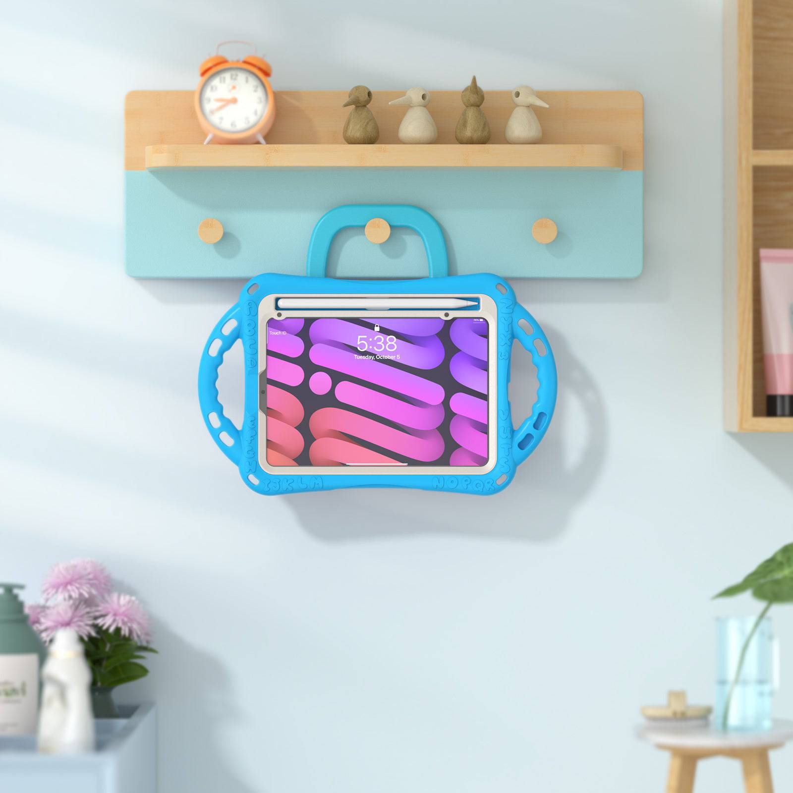 Blue Kitten Kids iPad Mini 6 Protective Case hanging on a wall, showcasing its foldable handle for convenient storage and accessibility.