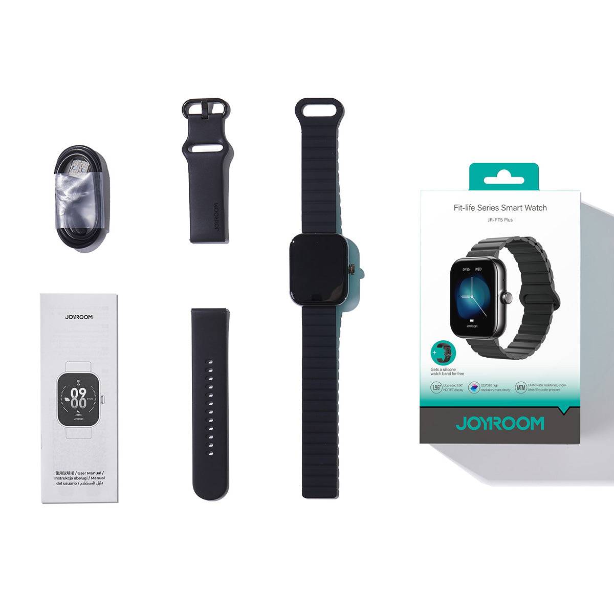 Unboxing of the JOYROOM JR-FT5 Plus Smart Watch in black, including the smartwatch, extra silicone strap, charging cable, and user manual.
