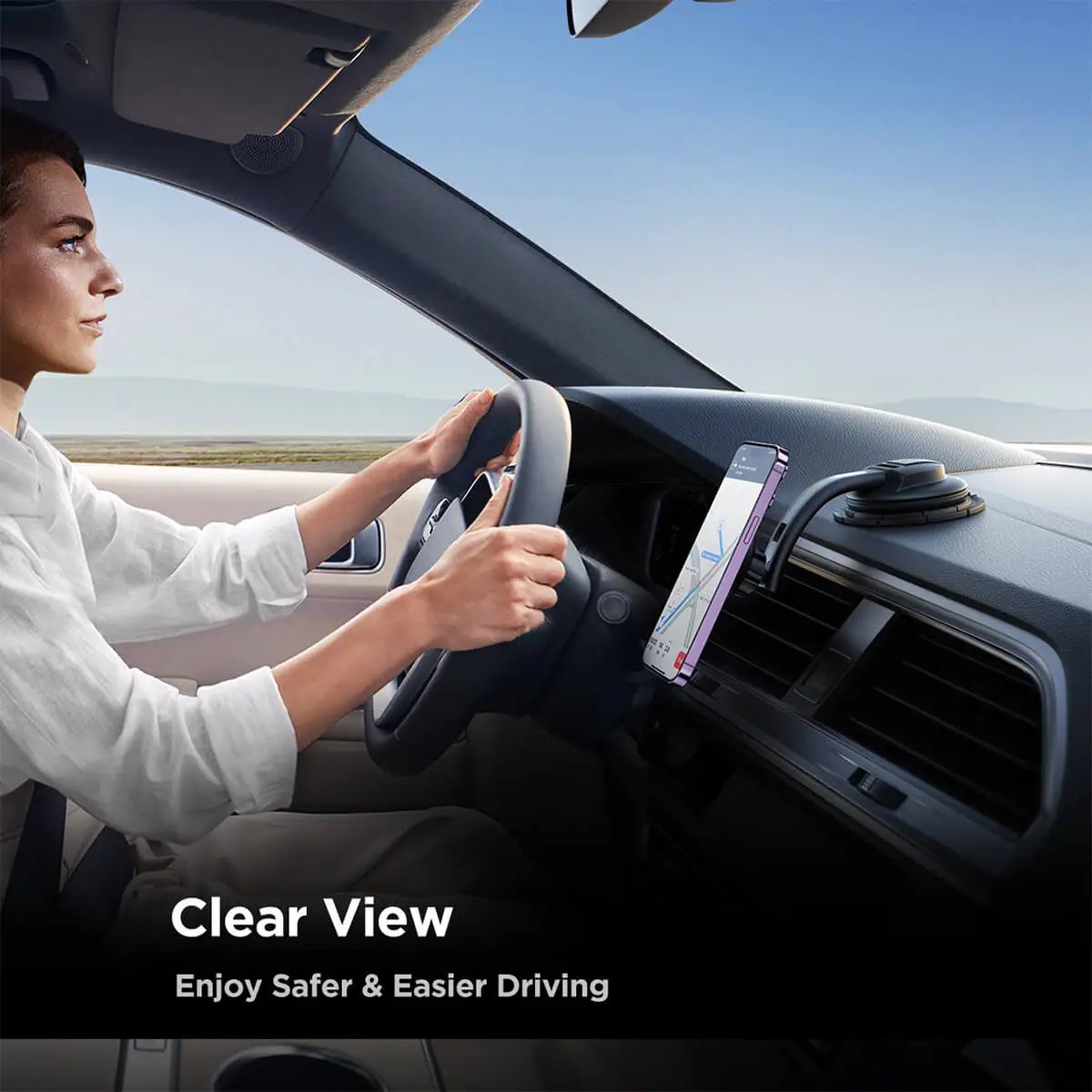 Driver using JOYROOM JR-ZS366-W magnetic car phone mount for a clear view and safer driving experience.