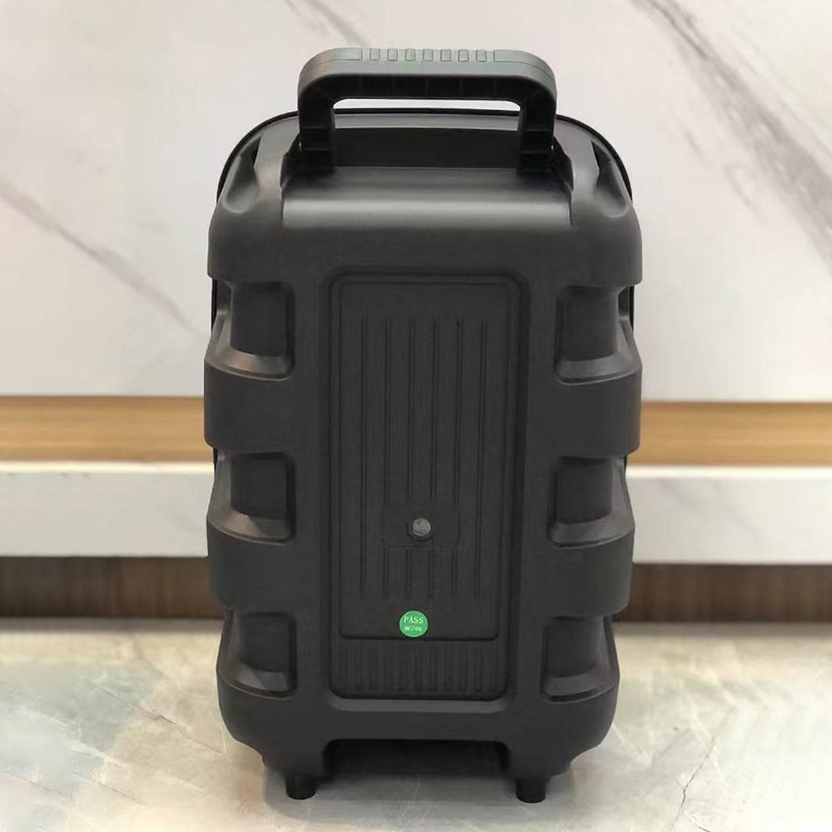 Rear view of KBQ-2422 Bluetooth Karaoke Speaker, highlighting its rugged design and built-in handle for easy transport.