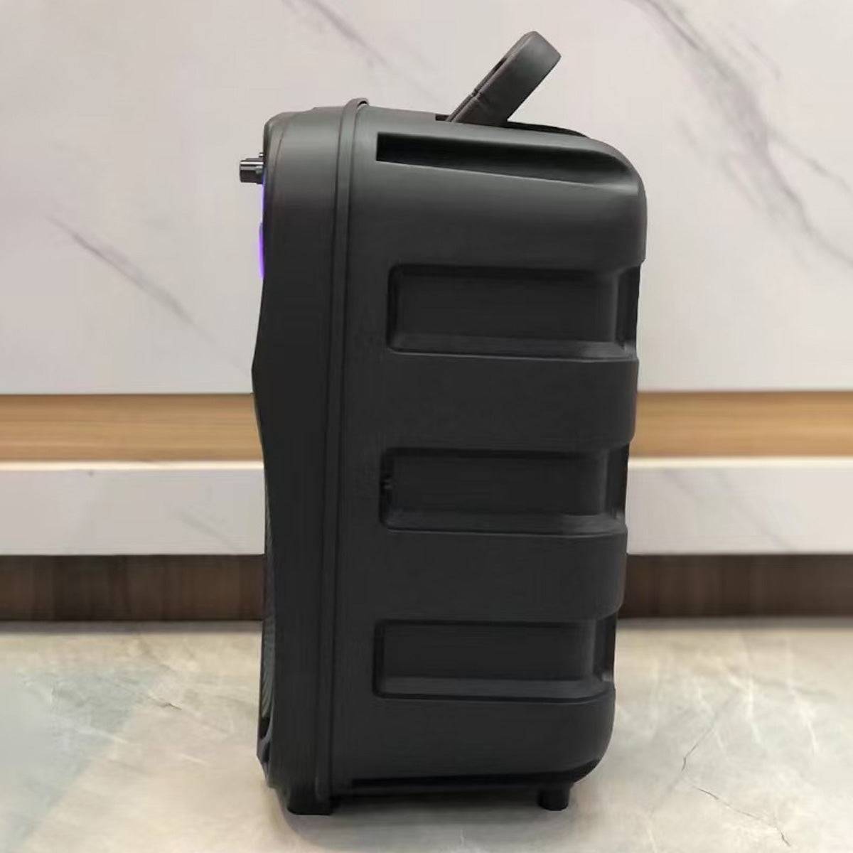 Side view of KBQ-2422 Bluetooth Karaoke Speaker, showing its durable build and ergonomic handle for portability.