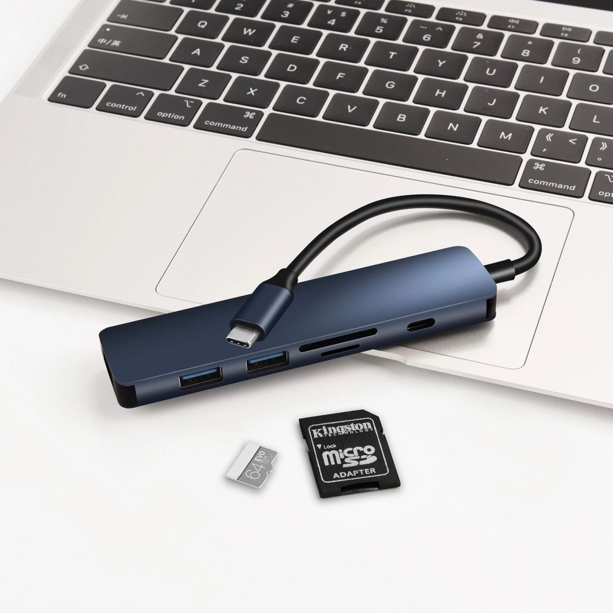 COTECi MB1084 TF SD Card Reader 6-IN-1 Type-C Hub Adapter connected to a laptop, featuring multiple ports for USB and SD card expansion.