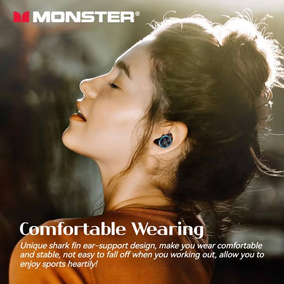 Woman enjoying music with MONSTER Clarity 101 Plus Airlinks True Wireless Earphones, featuring a shark fin ear-support design for a secure fit.
