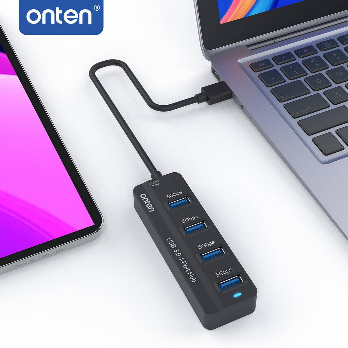 Onten 5305 USB 3.0 4-Port Hub connected to a laptop, expanding USB ports. High-speed data transfer and compact design for efficient workspace setup.