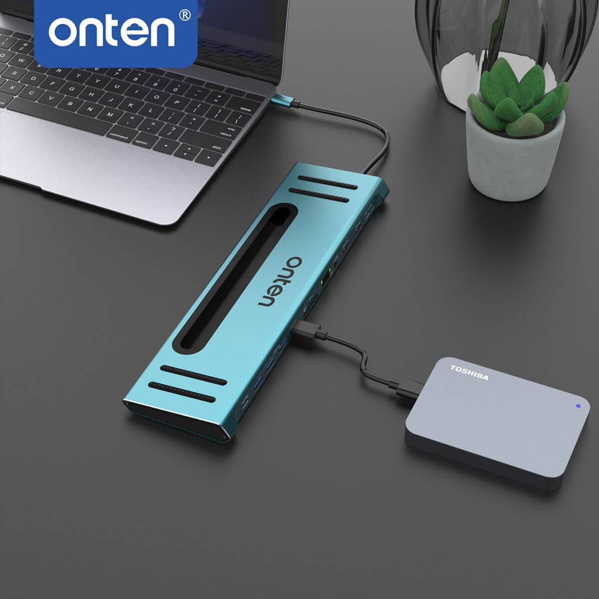 Onten 9199 docking station connected to a laptop and external hard drive, demonstrating its versatility in expanding storage and connectivity.