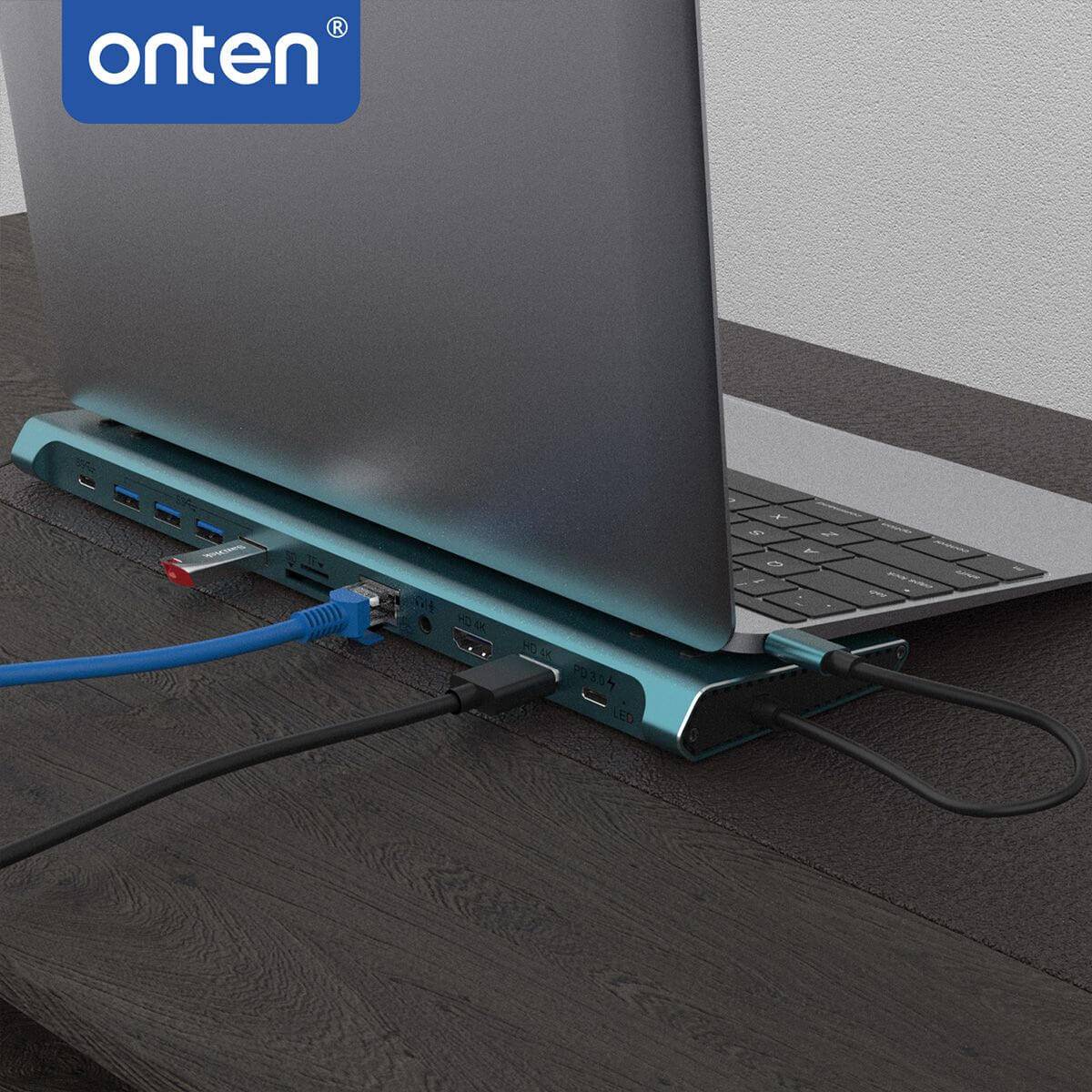 Onten 9199 docking station placed under a laptop, providing multiple connectivity options including HDMI, USB, and Ethernet for efficient workspace setup.