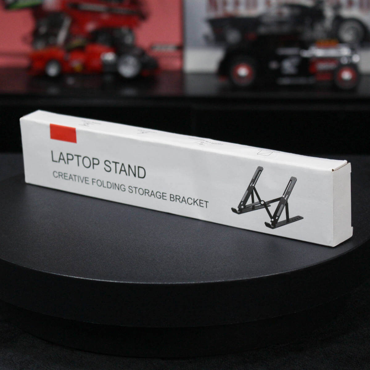 Z34 Laptop Stand packaging box labeled 'Creative Folding Storage Bracket.' Compact and sleek design for easy transportation.